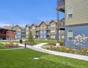 Landscaped areas with sidewalks at The Lodge Apartments at Marysville, WA.