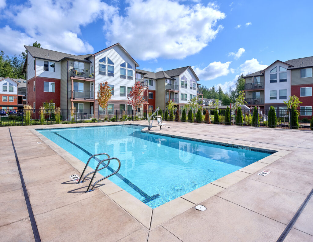 Spacious fenced-in pool area at The Lodge Apartments at Marysville, WA.
