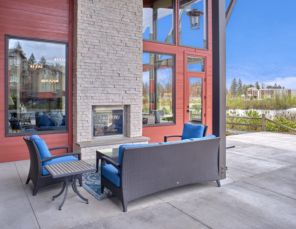 Outdoor fireplace area at The Lodge Apartments at Marysville, WA.