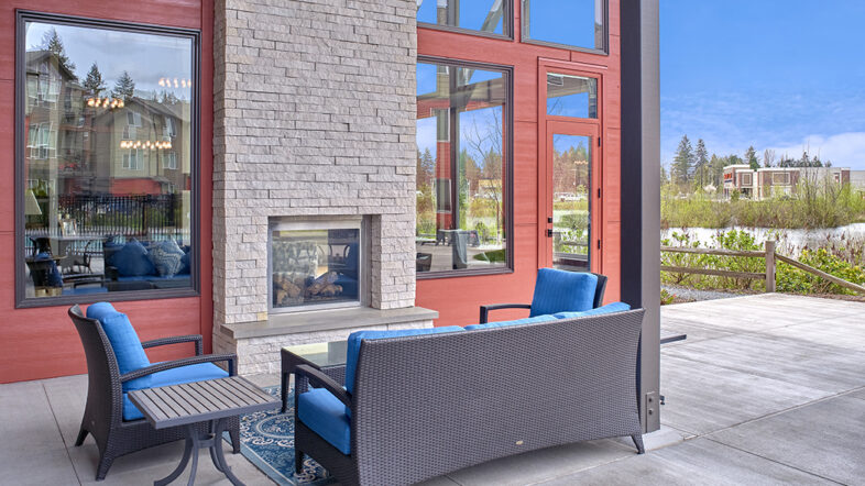 Outdoor fireplace area at The Lodge Apartments at Marysville, WA.