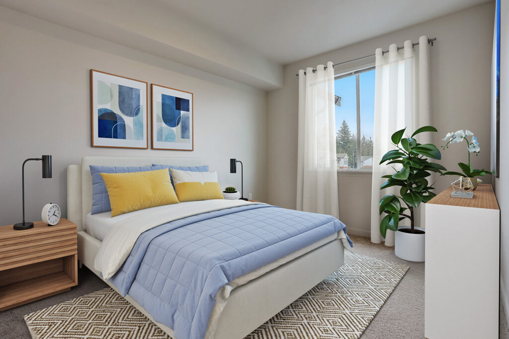 Carpeted bedroom with a window in an apartment at The Lodge at Marysville, WA.