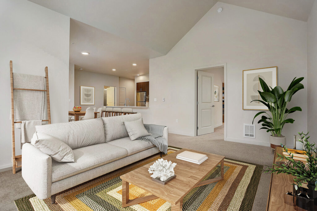 Apartment living room with large couch at The Lodge Apartments in Marysville, WA